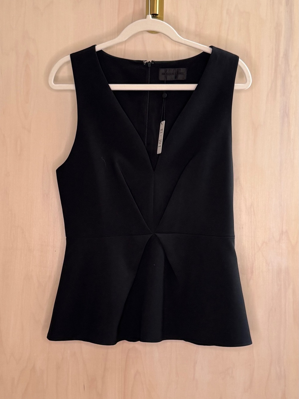 Sleeveless Black V-Neck Peplum Top by